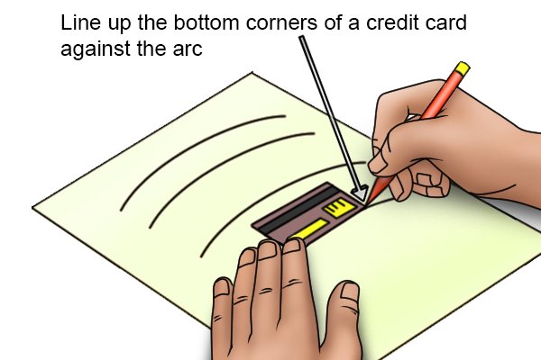 Line up the bottom corners of a credit card. 