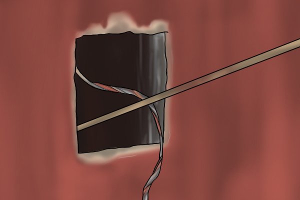 A rod set in use pulling cable through a wall 