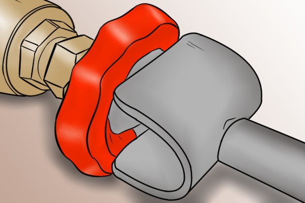 Mini crutch and wheel head stopcock key in use on wheel head valve