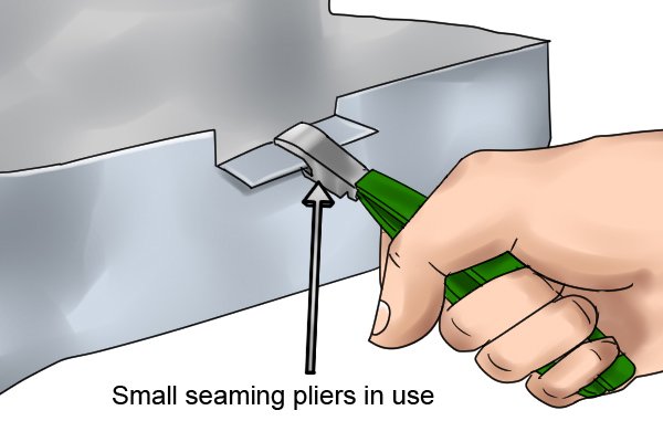 Small, bent seaming pliers in use