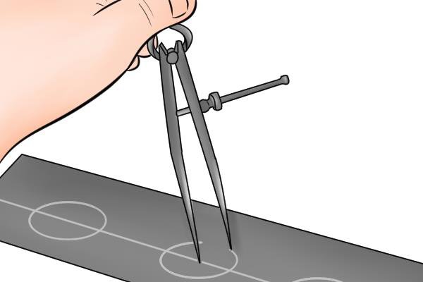 Dividers have fixed metal points and cannot be used with a pencil. The metal points of the tool are used to mark a surface.