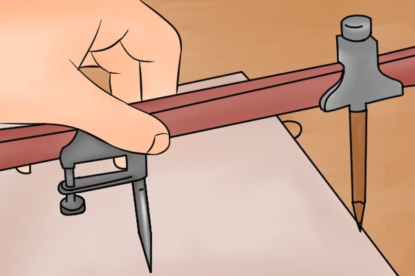 Step 4 - Set up your beam compass Set up your beam compass by clamping each of your trammel heads to a beam. The distance between the two trammels on the beam is not critical, although they should be more than half the length of the primary line apart.