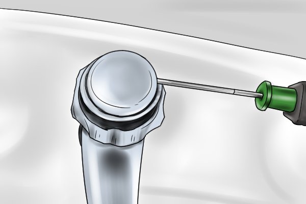 remove the tap cap with flat object