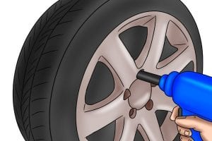 Impact wrench removing a wheel