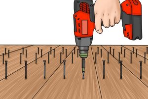 Illustration of impact driver in use with wood.