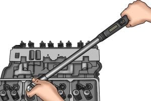 Mechanic using a torque wrench