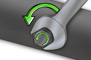 Diagram of how to remove a nut from a bolt with a spanner.