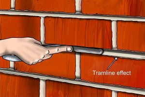 Tramline effect caused by a brick jointer being too small for the gap.