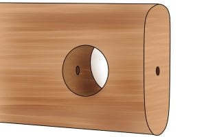 Hole in wood made by auger bit