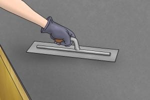 As the water is finished being absorbed use a trowel on the newly floated concrete.