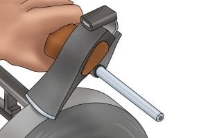 Repeat the process of filing the axe to sharpen until desired sharpness