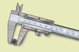 Vernier caliper measuring a socket set