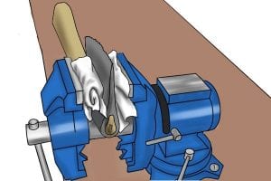 Step 1: Secure the axe in a vice