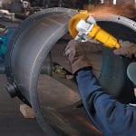 DeWalt DW840 Angle Grinder​ in use cutting