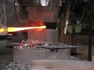 Drop forged steel being moulded.
