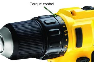 Adjusting torque control on drills.