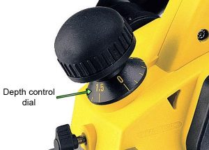 A knob is used to adjust the planer's cutting depth.