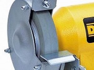 Detailed view of a DeWalt bench grinder wheel.