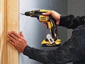 DeWalt Drywall Screwdriver being used to drill into the wall.