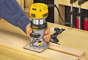Dewalt router in use on wood.