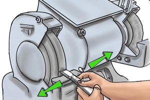 Bench grinder used by sliding the material side to side.