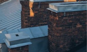 Lead flashing around chimneys on a roof.