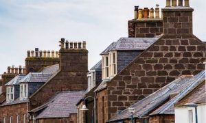 Lead flashing secured around chimneys and roofing.