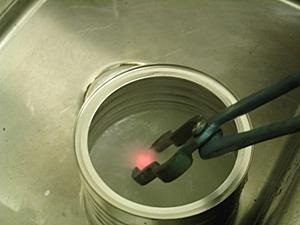 Metal being cooled in salt water.