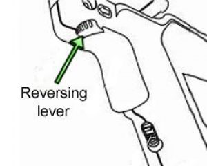 Percussion drill reversing lever.