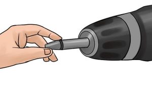 Removing a bit from a chuck from a drill.