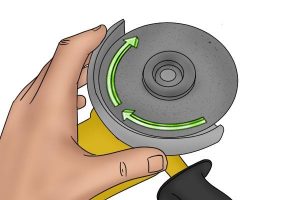 Rotating the disc on angle grinder and twisting it off.