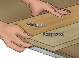 Routing using sacrificial plank of wood.