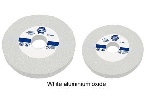 Two white grounding wheels manufactured with white aluminum oxide.