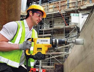 Using SDS max drill on concrete wall.