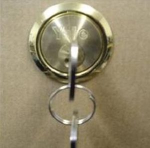 Rim Cylinder lock with key on a pull door.